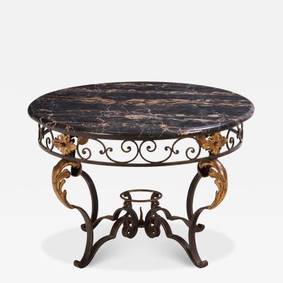 French iron and gilt decorated coffee table with Portoro Nero marble top 