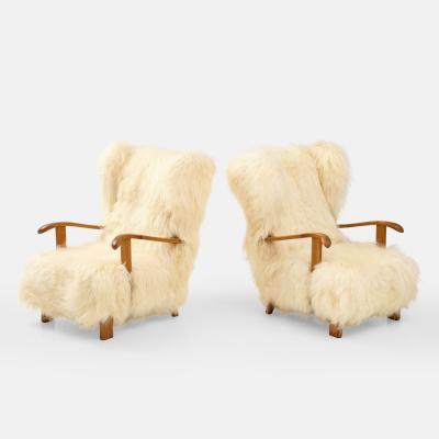 Fritz Hansen Rare Pair of Wingback Lounge Chairs Model 1582 in Sheepskin by Fritz Hansen