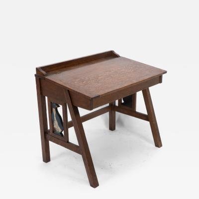 G F Hardy An oak childs desk with a slanted writing area and storage underneath