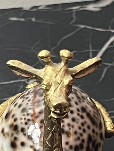 GOLD METAL GIRAFFE WITH COWRIE SHELL BODY SCULPTURE