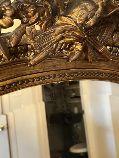 GRAND 19TH CENTURY GILTWOOD MIRROR WITH BIRD ARROWS TORCH CREST