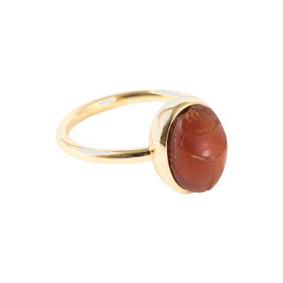 Gabriela Sismann RING COMPOSED OF AN EGYPTIAN CARNELIAN BEETLE NEW KINGDOM 