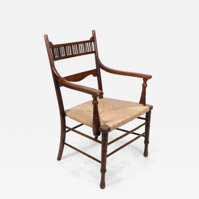 George Bell George Freeth Roper Aesthetic Movement Walnut rush seat armchair 