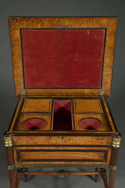 George Bullock A Regency gilt brass mounted burr oak ebony and brass marquetry center table