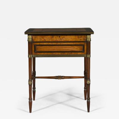 George Bullock A Regency gilt brass mounted burr oak ebony and brass marquetry center table