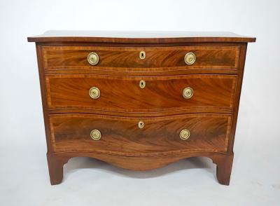 George Hepplewhite George III Mahogany and Satinwood Serpentine Commode