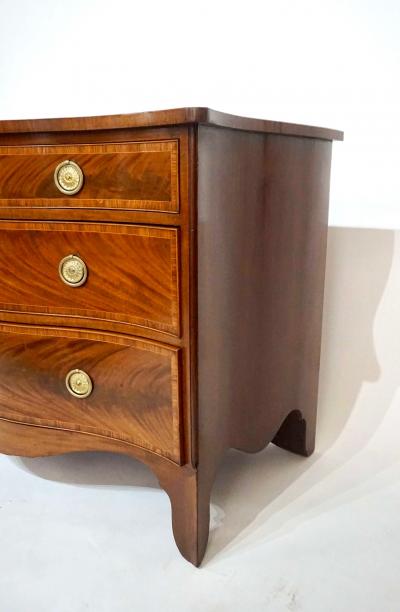 George Hepplewhite George III Mahogany and Satinwood Serpentine Commode