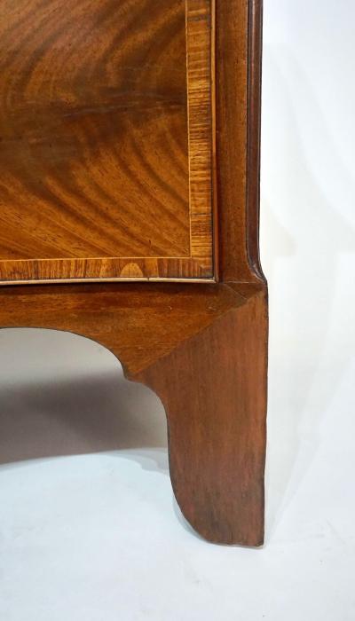 George Hepplewhite George III Mahogany and Satinwood Serpentine Commode