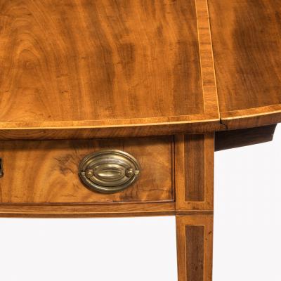 George III oval mahogany and king wood banded Pembroke table
