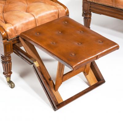 George Minter A pair of William IV adjustable mahogany library armchairs by George Minter