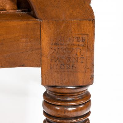 George Minter A pair of William IV adjustable mahogany library armchairs by George Minter