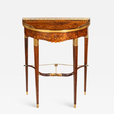 Georges Fran ois Alix A French demi lune rosewood bow and arrow table by Georges Fran ois Alix