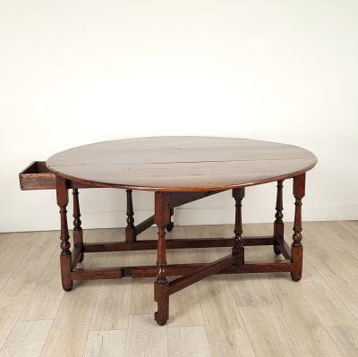 Georgian Oak or Elm Round Dropleaf Table England circa 1720