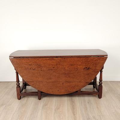 Georgian Oak or Elm Round Dropleaf Table England circa 1720