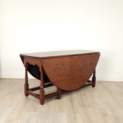 Georgian Oak or Elm Round Dropleaf Table England circa 1720