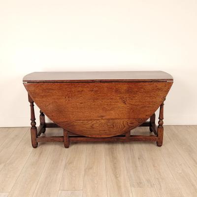 Georgian Oak or Elm Round Dropleaf Table England circa 1720
