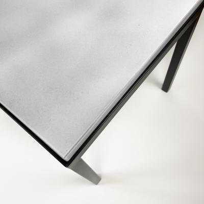 Gerard Simo n PAIR OF WHITE GLAZED LAVA STONE SIDE TABLES