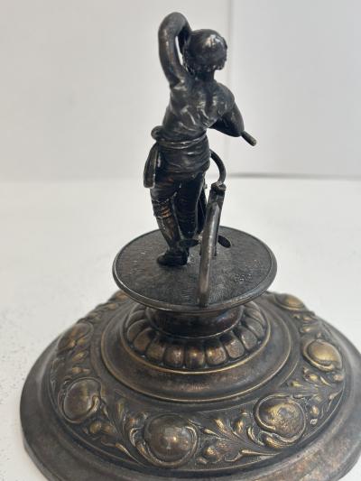 German silver plate chalice with floral relief and bicycle rider finial on lid