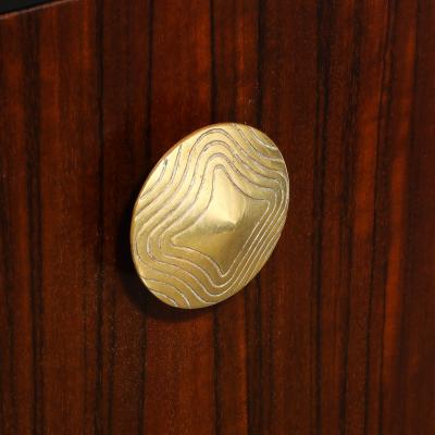 Gilbert Rohde Art Deco Brass Pulls Leather Wrapped Base Paldao Wood Cabinet by Gilbert Rohde
