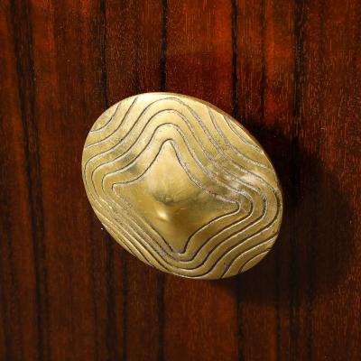 Gilbert Rohde Art Deco Brass Pulls Leather Wrapped Base Paldao Wood Cabinet by Gilbert Rohde