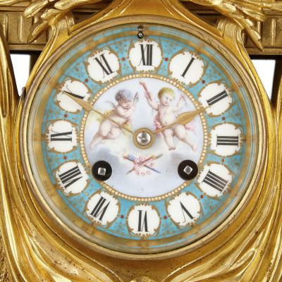 Gilt bronze and S vres style porcelain clock garniture