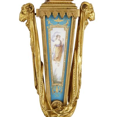 Gilt bronze and S vres style porcelain clock garniture