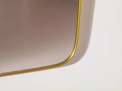 Gio Ponti A mid century Italian brass mirror in the style of Gio Ponti 1960s