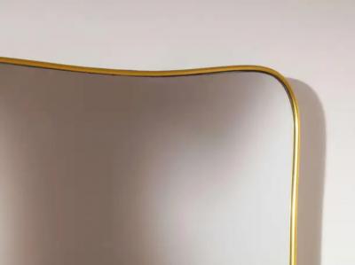 Gio Ponti A mid century Italian brass mirror in the style of Gio Ponti 1960s