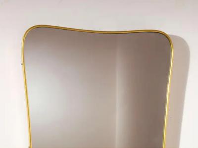 Gio Ponti A mid century Italian brass mirror in the style of Gio Ponti 1960s
