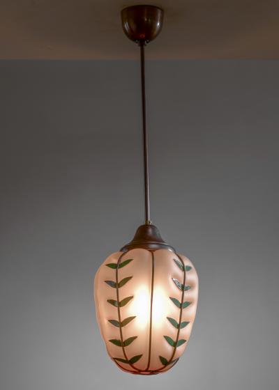 Glass pendant with metal leaves