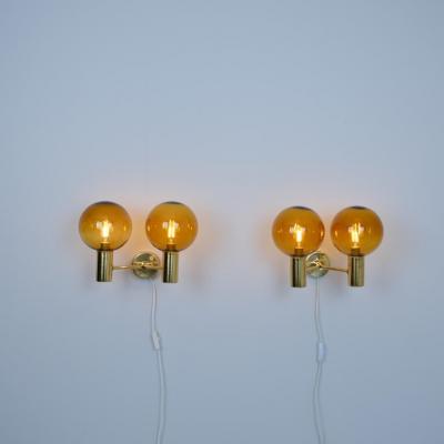 Hans Agne Jakobsson Pair of Hans Agne Jakobsson Brass Scones Model V 149 2 Amber Glass 1950s