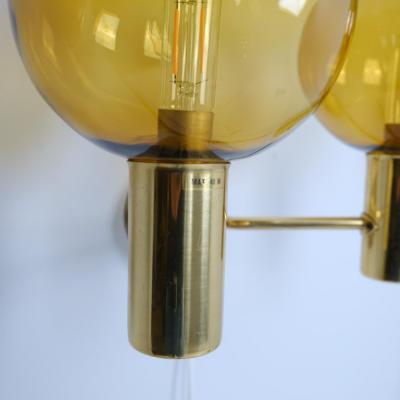 Hans Agne Jakobsson Pair of Hans Agne Jakobsson Brass Scones Model V 149 2 Amber Glass 1950s