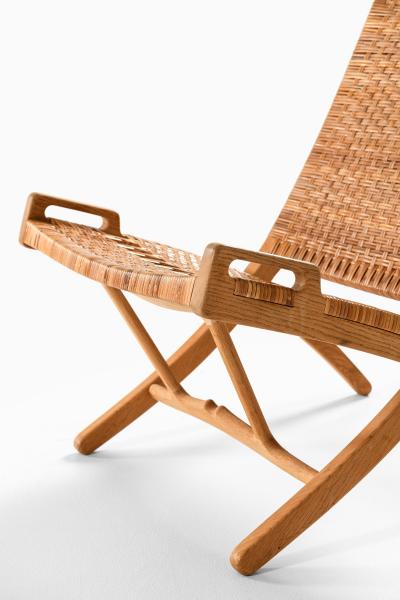 Hans Wegner Folding Easy Chair in Cane and Oak by Hans Wegner 1949