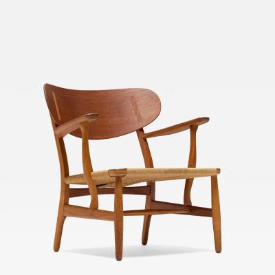 Hans Wegner Hans Wegner CH22 Lounge chair in Oak Pair Avalible 