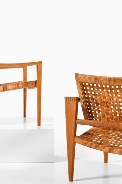 Hans Wegner Pair of Easy Chairs in Oak Woven Cane Brass and Leather by Hans Wegner 1959