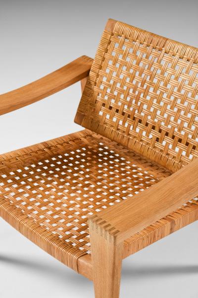 Hans Wegner Pair of Easy Chairs in Oak Woven Cane Brass and Leather by Hans Wegner 1959