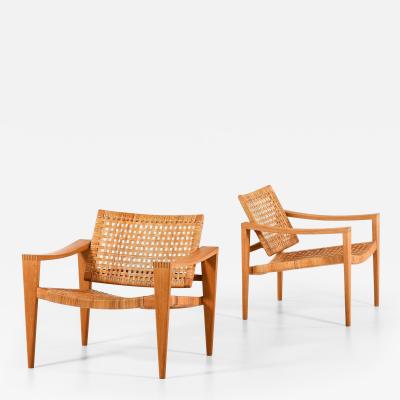 Hans Wegner Pair of Easy Chairs in Oak Woven Cane Brass and Leather by Hans Wegner 1959