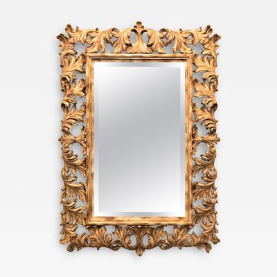 Heavily Carved French Frame Flanking a Bevelled Glass Wall or Console Mirror