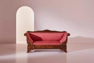 Henry Thomas Peters A carved walnut sofa with boat shaped form in the style of Henry Thomas Peters