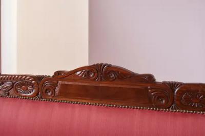 Henry Thomas Peters A carved walnut sofa with boat shaped form in the style of Henry Thomas Peters