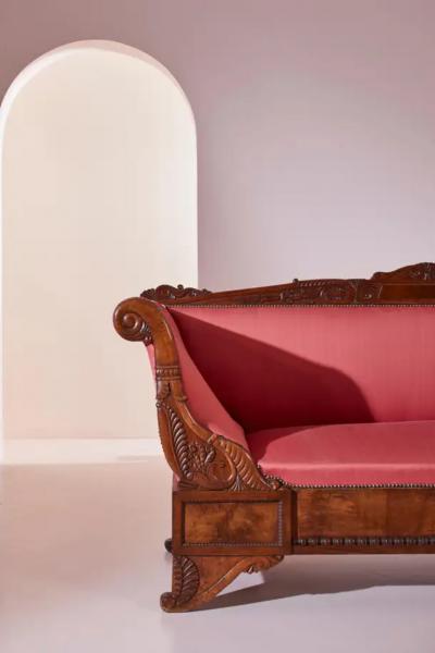 Henry Thomas Peters A carved walnut sofa with boat shaped form in the style of Henry Thomas Peters
