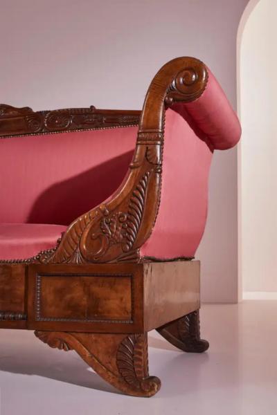 Henry Thomas Peters A carved walnut sofa with boat shaped form in the style of Henry Thomas Peters