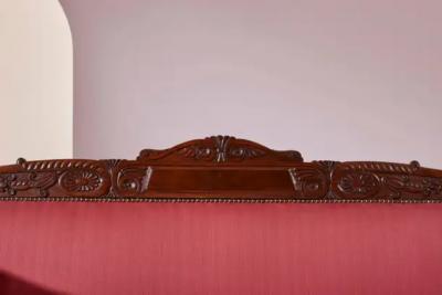 Henry Thomas Peters A carved walnut sofa with boat shaped form in the style of Henry Thomas Peters