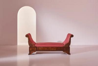 Henry Thomas Peters A carved walnut sofa with boat shaped form in the style of Henry Thomas Peters