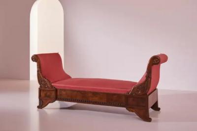 Henry Thomas Peters A carved walnut sofa with boat shaped form in the style of Henry Thomas Peters