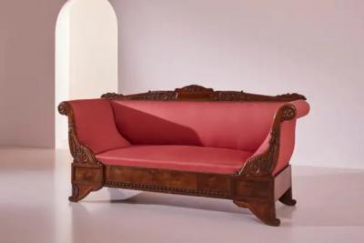 Henry Thomas Peters A carved walnut sofa with boat shaped form in the style of Henry Thomas Peters