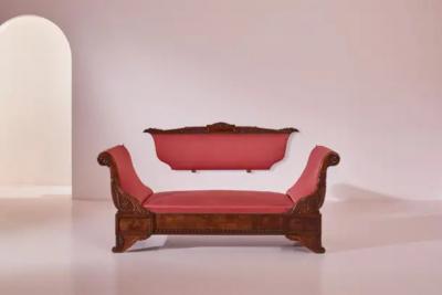 Henry Thomas Peters A carved walnut sofa with boat shaped form in the style of Henry Thomas Peters