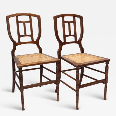 Henry William Batley H W Batley attr Jas Shoolbred Pair of Aesthetic Movement cane seat beech chairs
