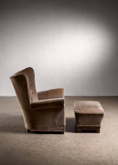 Highback easy chair with ottoman