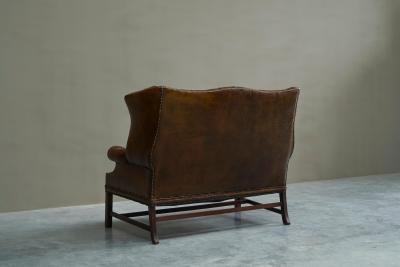 Highly Original Tufted English Wingback Settee in Patinated Leather 1900
